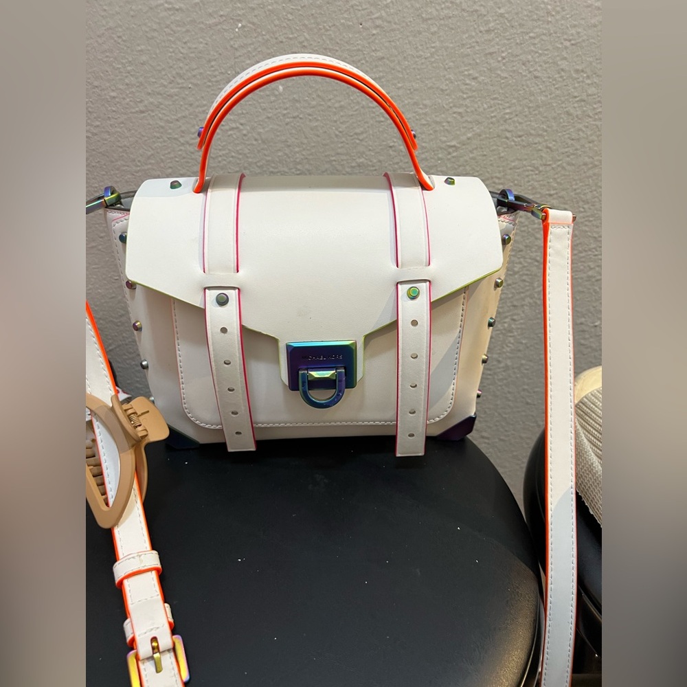 Michael Kors white purse with multi colored accents. Very gently used.